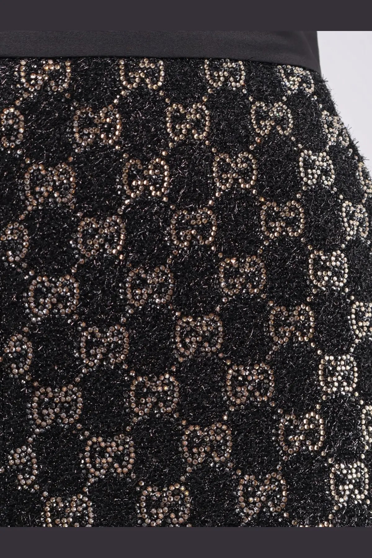 Gucci women’s lightweight lamé wool tweed black shorts with black textured skirt and metallic gucci bead logos pattern