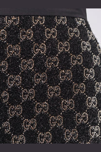 Gucci women’s lightweight lamé wool tweed black shorts with black textured skirt and metallic gucci bead logos pattern