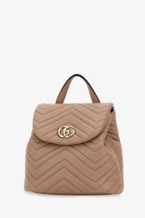 Beige quilted leather mini backpack with gold-tone interlocking gg logo clasp by Gucci women’s collection