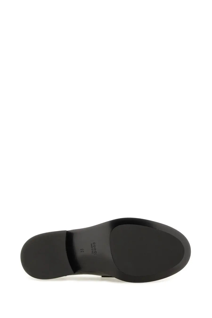 Back side of gucci women’s moccasin black showing smooth matte black rubber sole with subtle heel branding