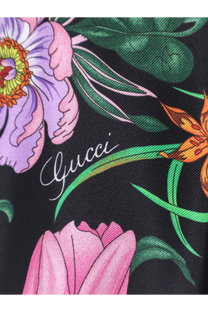 Black Gucci women’s printed silk shirt featuring a vibrant floral pattern with purple pink green and orange blossoms