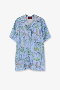 Light blue Gucci women’s printed silk short-sleeved shirt with detailed green pink and orange botanical floral print