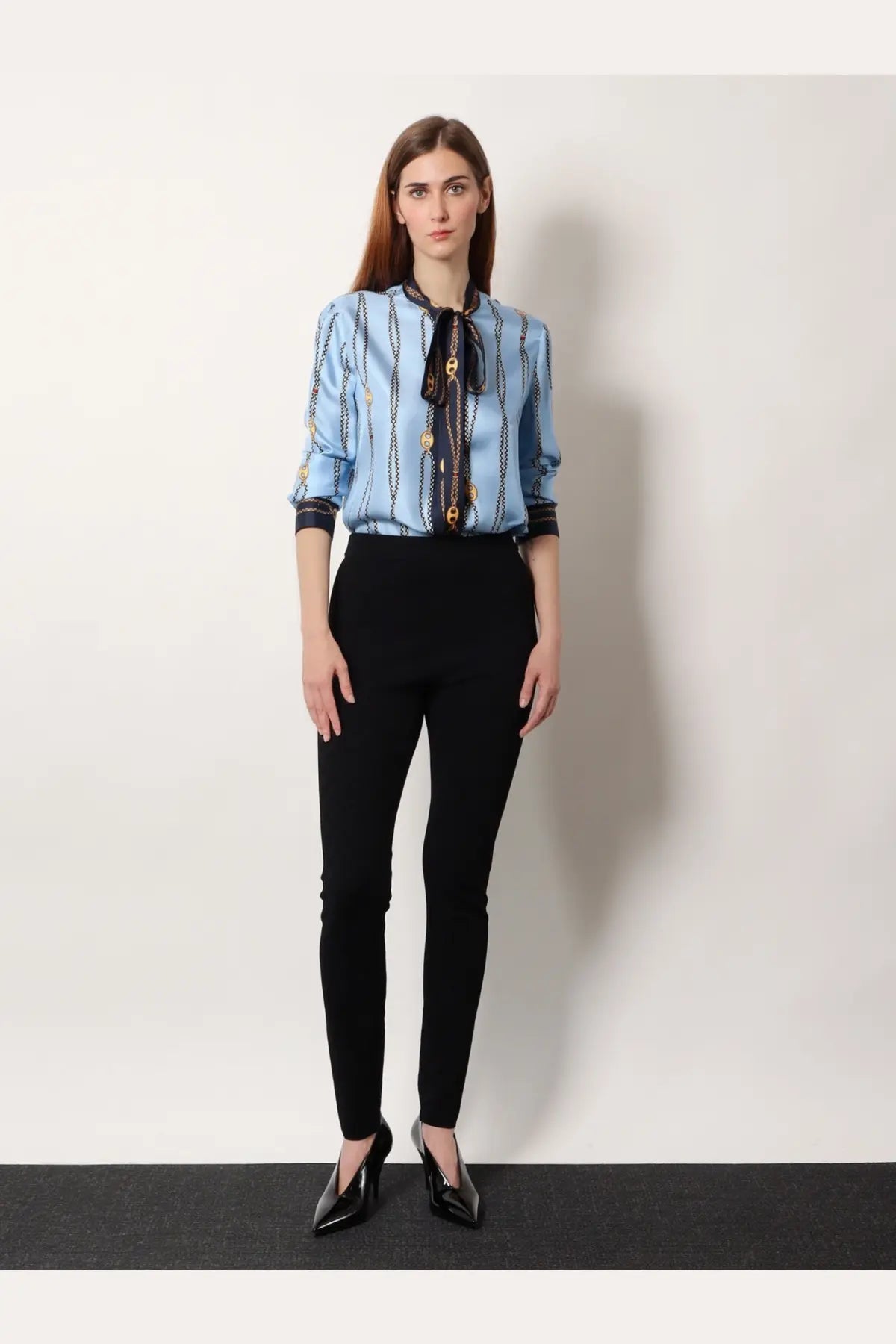 Gucci women’s light blue silk twill blouse with gold chain pattern and black tie front detail