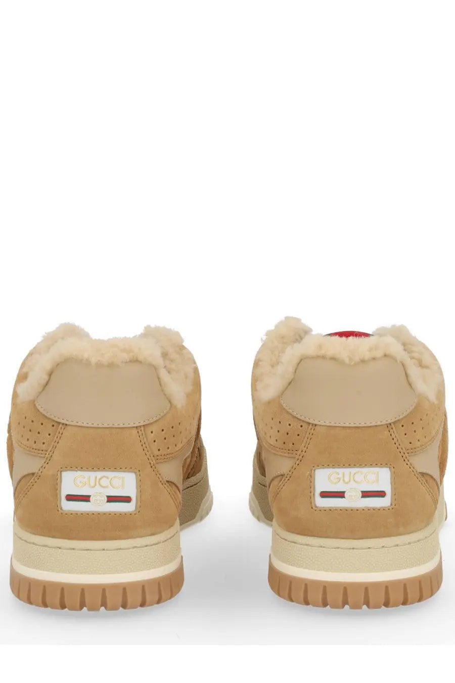 Tan suede Gucci women’s RE Web sneaker with plush white shearling lining and beige rubber sole front view