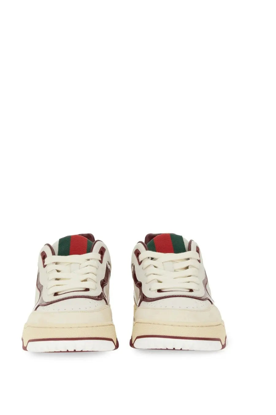 Cream-colored Gucci women’s RE Web sneakers with red and green striped tongue accents in leather and suede materials