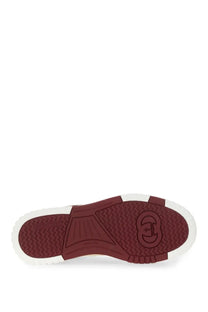 Red rubber sole with white edge and embossed gucci logo on the gucci womens gucci re web sneaker white
