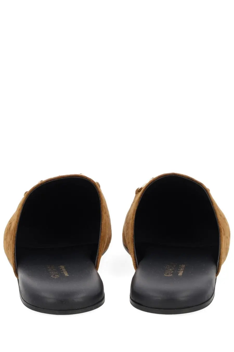 Gucci women’s sabot brown tan suede mules with black rubber soles shown from the back side
