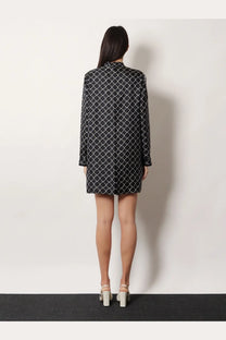 Gucci women’s short black silk twill mini dress with white geometric lattice pattern and long sleeves
