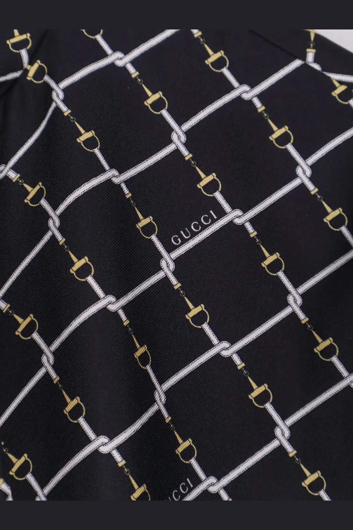 Black gucci silk scarf with a repeating white and gold horsebit chain pattern for gucci womens short silk twill dress
