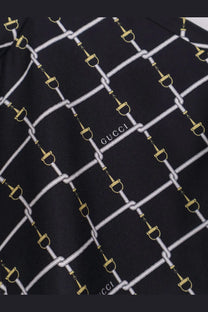 Black gucci silk scarf with a repeating white and gold horsebit chain pattern for gucci womens short silk twill dress