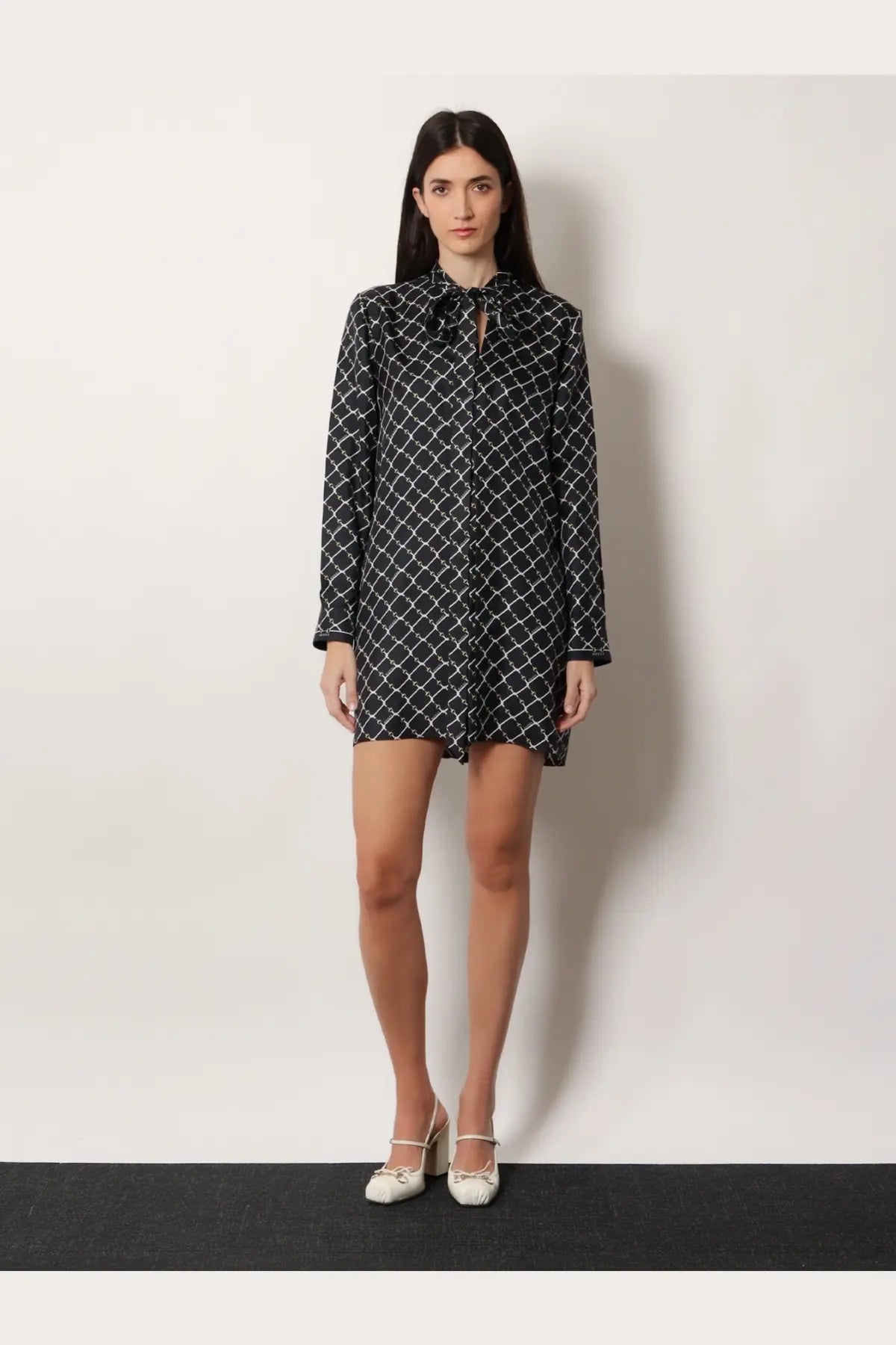 Gucci women’s black long-sleeved silk twill dress with white geometric pattern and tie-neckline detail