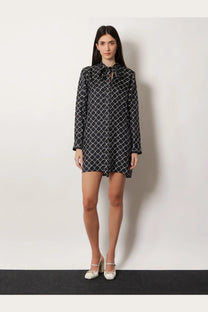 Gucci women’s black long-sleeved silk twill dress with white geometric pattern and tie-neckline detail