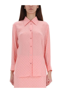Gucci women’s soft pink silk blouse with subtle repeating pattern and classic button-down design