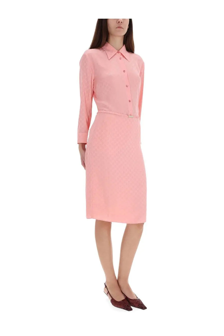 A soft pink silk long-sleeved tailored button-down dress with matching belt from Gucci women’s collection