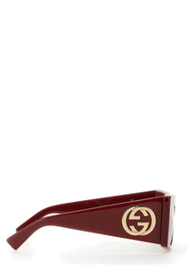 Gucci women’s square sunglasses in burgundy acetate with gold-tone interlocking GG logo on the temple