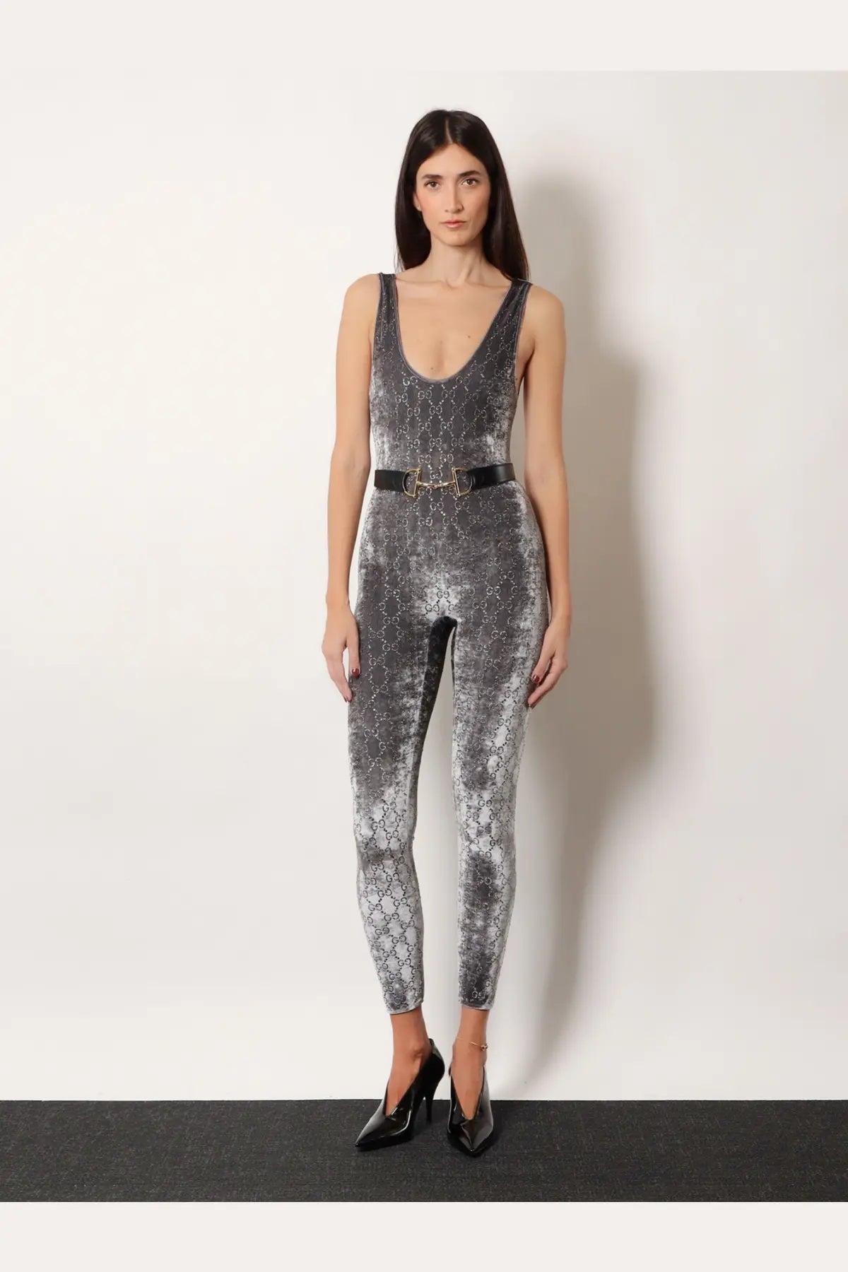 Gucci women’s stretch chenille jumpsuit in grey velvet with a repeating logo pattern and black leather belt accent