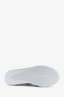 Back side of gucci women’s stretch leather sneakers white showing white rubber sole with textured ribbed pattern and embossed logo
