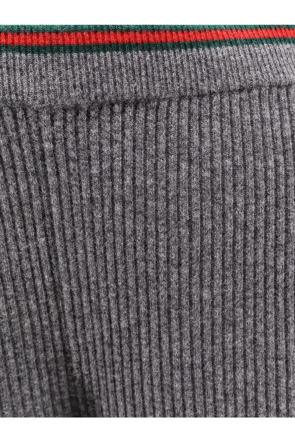 Grey ribbed knit sweater with red and green striped trim paired with gucci womens stretch wool trousers grey
