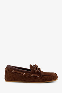 Gucci women’s brown suede loafers with repeating gg monogram pattern and metallic eyelets pretty ch model