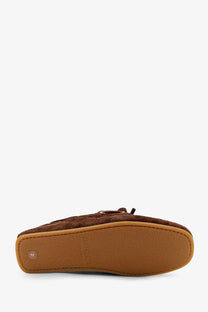 Brown suede Gucci women’s moccasin loafer with tan rubber sole and embossed logo perfect for casual wear