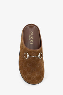 Gucci women’s brown suede mule slip-on sandal with silver horsebit buckle and embossed GG monogram pattern