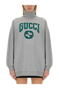 Gucci women’s grey sweatshirt with teal embroidered logo and lettering made from soft cotton material