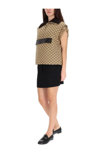 Gucci women’s beige and black gg supreme monogram sleeveless vest with contrasting black collar and horizontal band