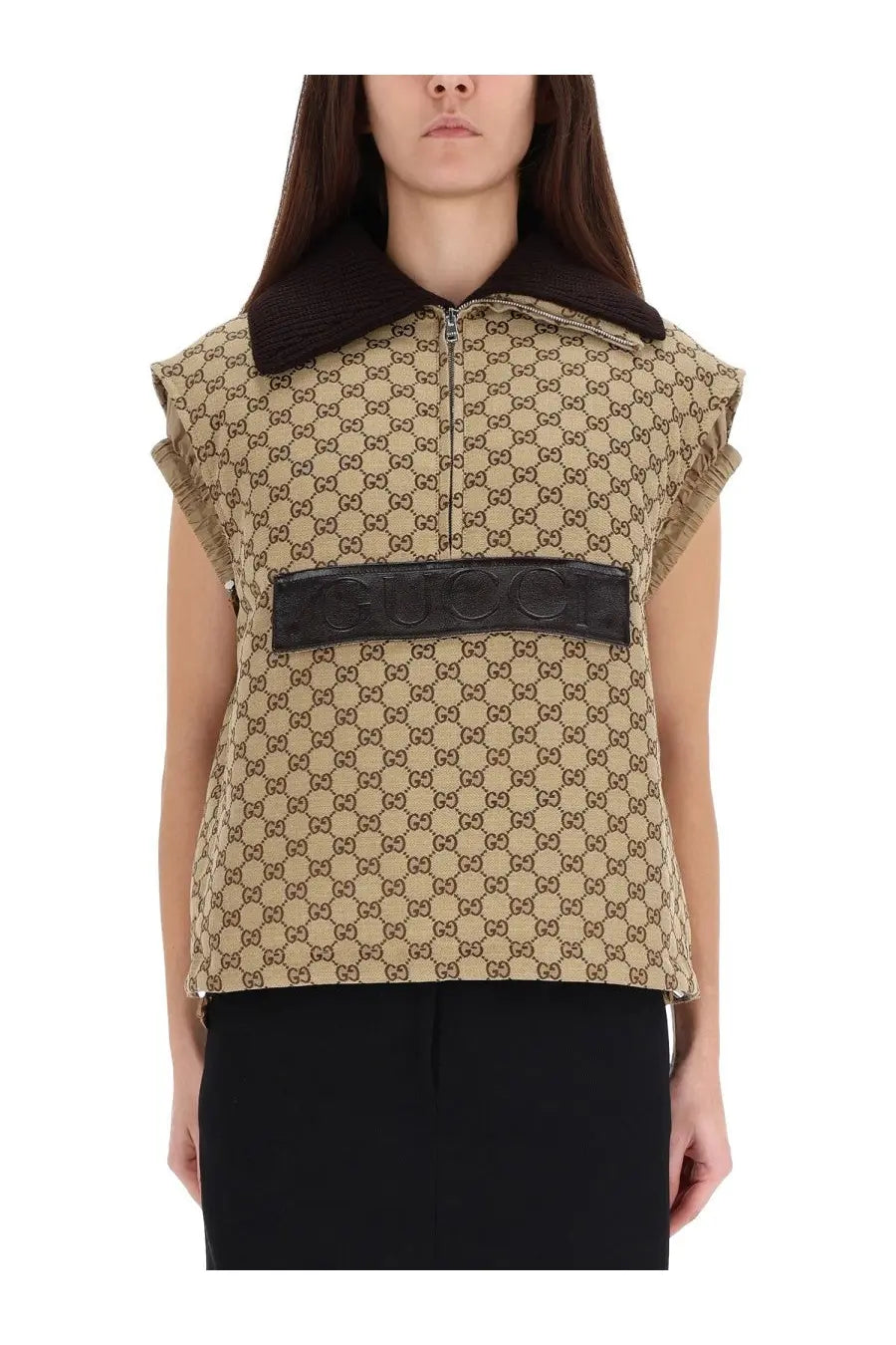 Beige Gucci women’s vest with brown interlocking GG pattern black leather belt across chest and plush collar