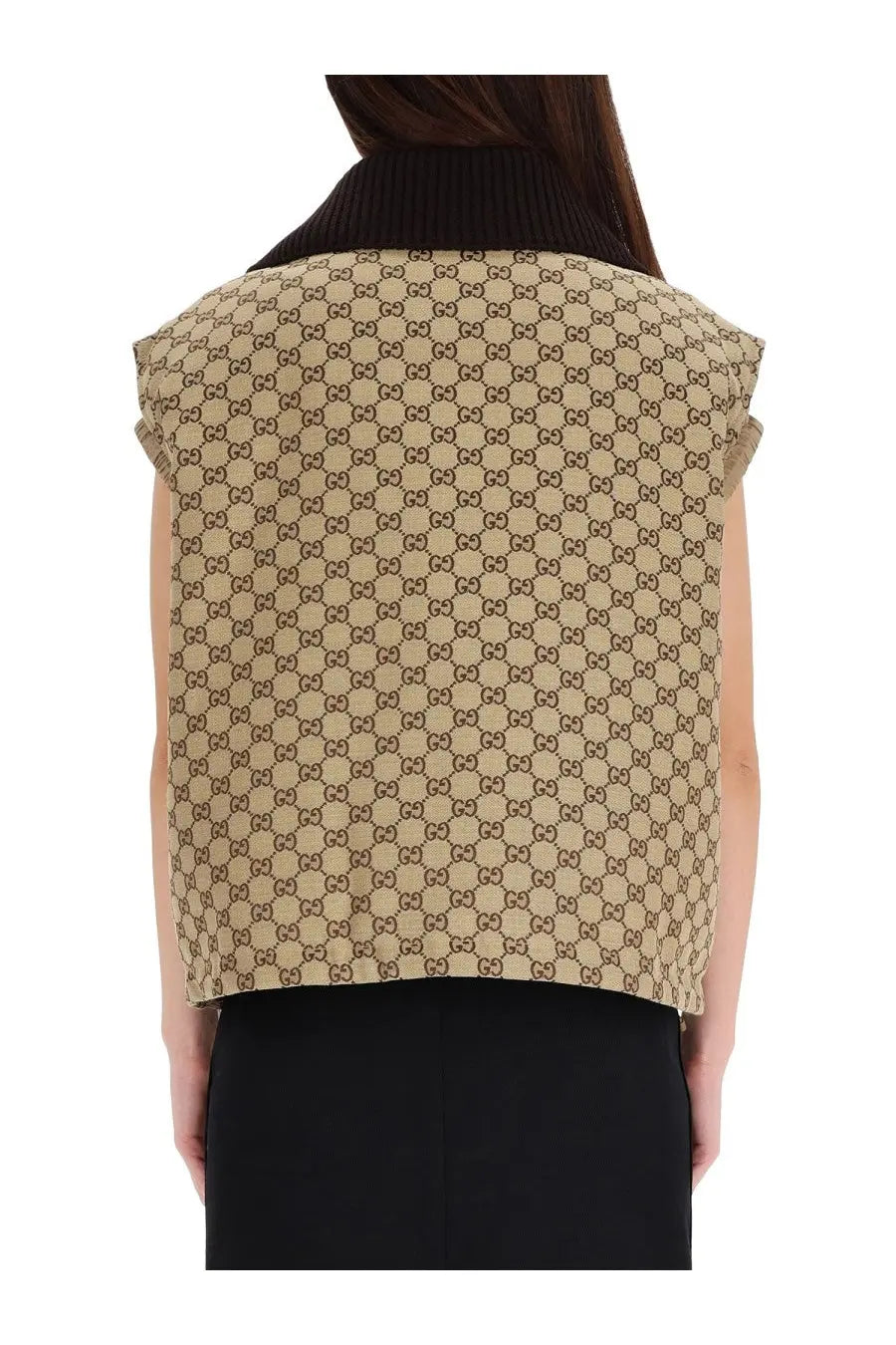 Beige Gucci women’s sleeveless vest with GG supreme print and black ribbed collar made from durable canvas material