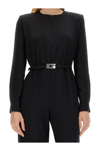 Black givenchy leather belt with silver diamond encrusted g buckle on gucci women’s viscose jumpsuit black