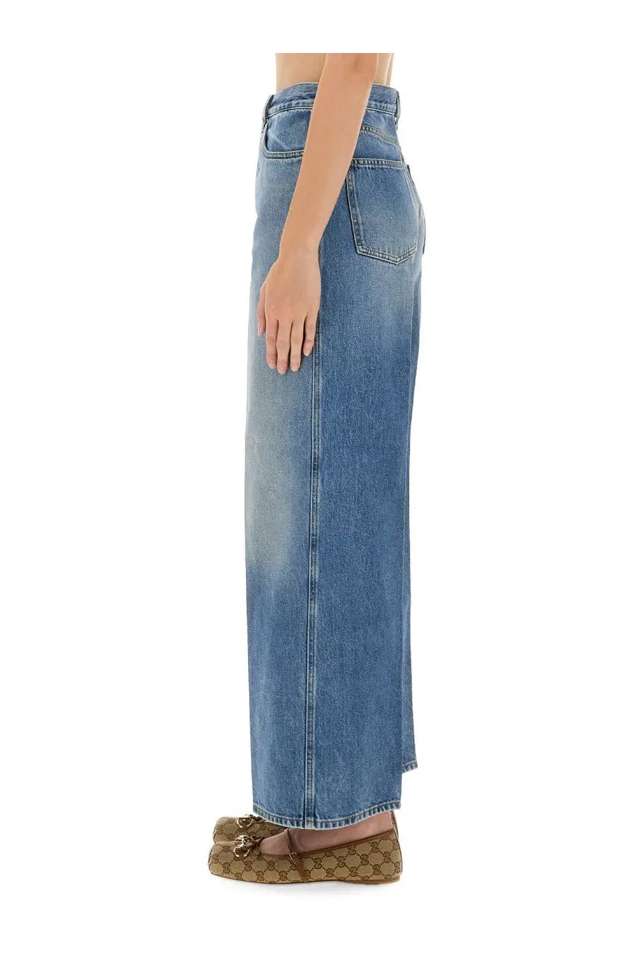 Back view of gucci women’s high-waisted wide-leg denim skirt in medium blue wash with classic stitching and pockets