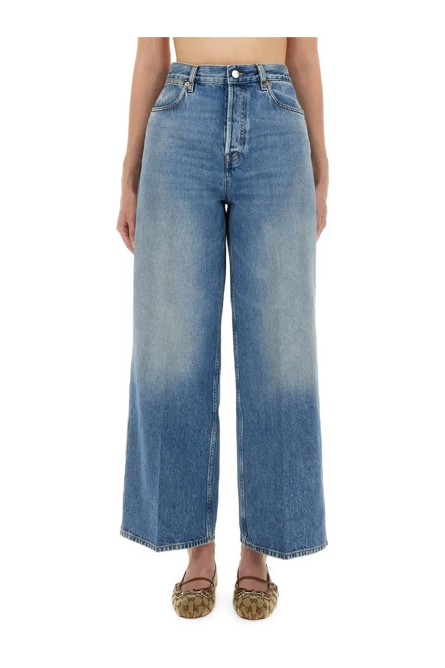 Gucci women’s wide leg jeans in faded blue denim with high waist, classic stitching, and button closure