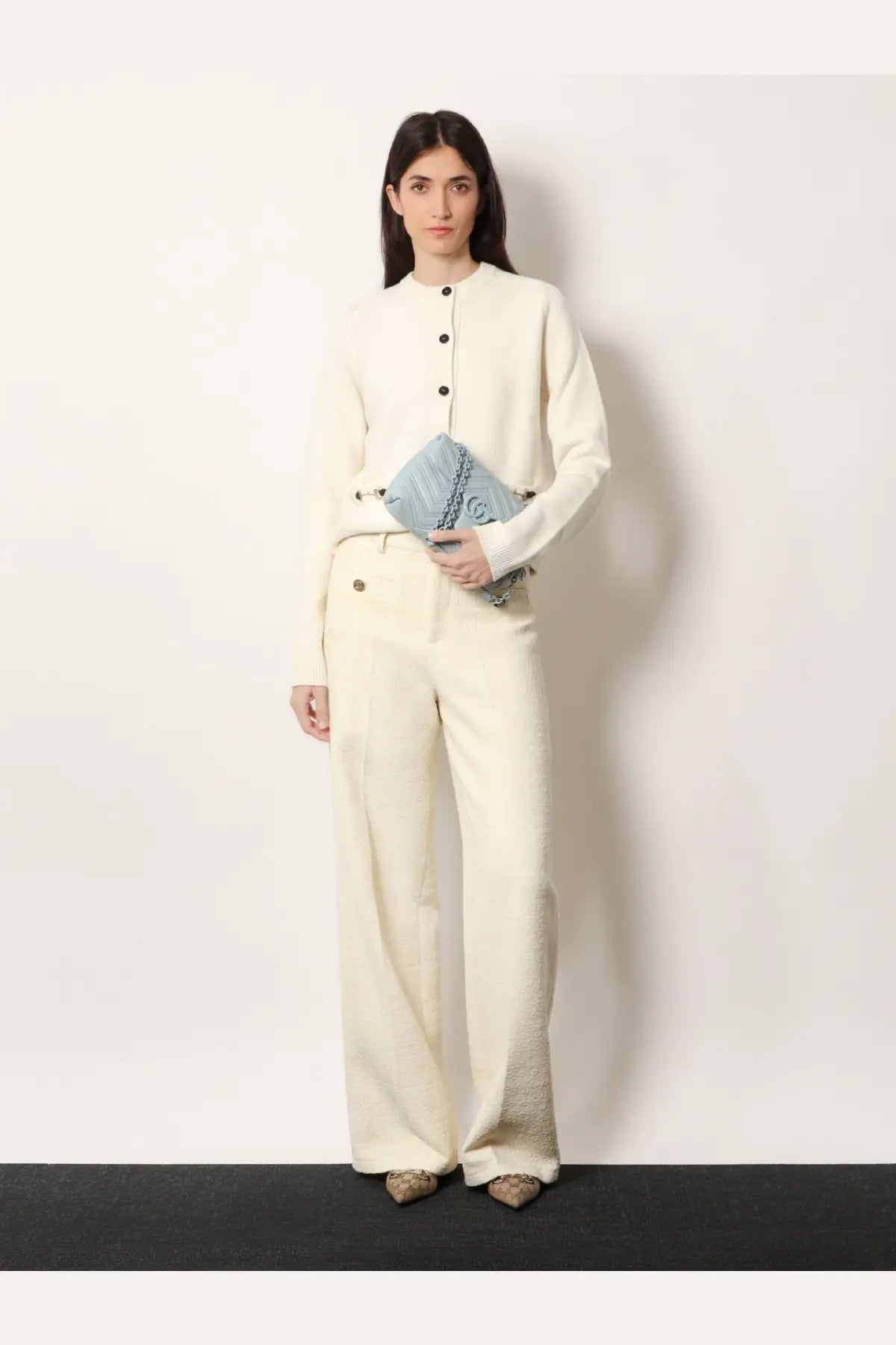 Light blue quilted chanel clutch with silver chain strap paired with gucci women’s white wool and cashmere cardigan