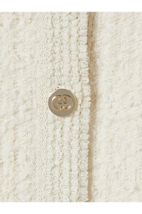 A cream-colored tweed button with a gold-tone interlocking gg logo on gucci womens wool and cotton blend cardigan white