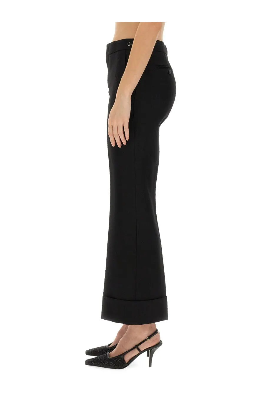 Gucci women’s black wool high-waisted flared trousers with tailored fit and rolled cuffs