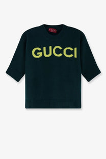 Gucci women’s green wool sweater with bold textured yellow gucci lettering across the chest