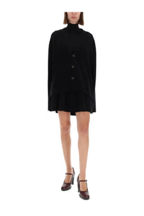 Black oversized turtleneck dress with tiered hem and front button closure from guest in residence women’s everywear cardigan collection