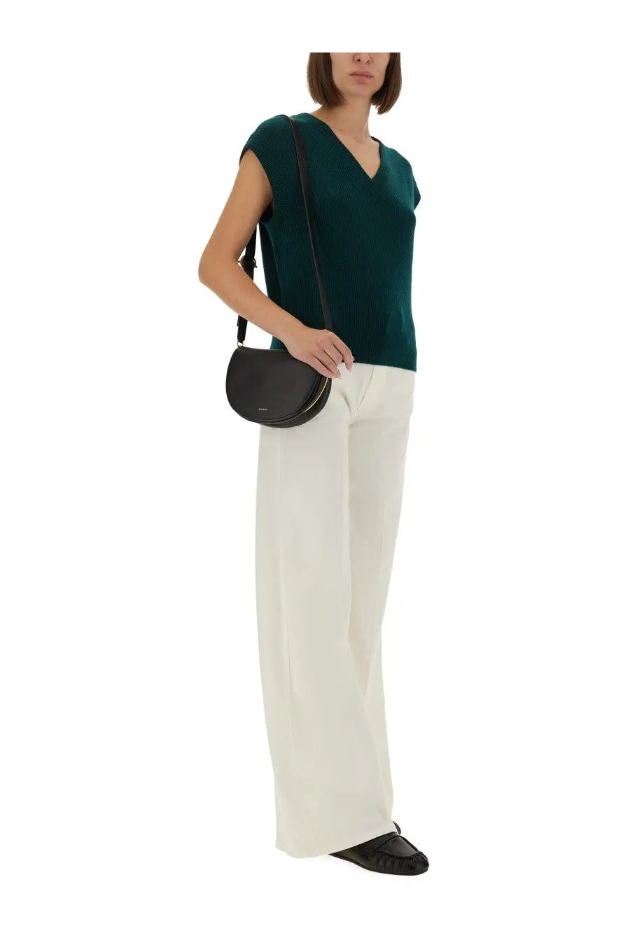 Black leather crossbody bag with sleek minimalist design and subtle stitching details for guest in residence vest look