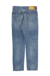 Haikure men’s jeans Tokyo Blue in blue denim with faded wash and tan leather brand label at the waistband back side