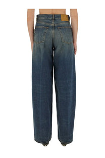 Haikure women’s bethany jeans blue high-waisted wide-leg denim jeans medium blue wash back side with leather patch