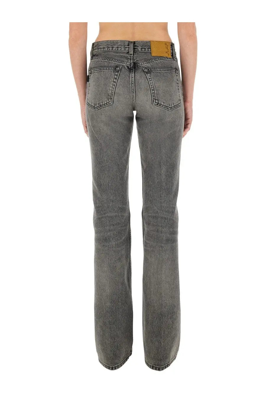 Haikure women’s jeans flora grey dark gray faded denim shown from the back with classic pocket and tan leather patch
