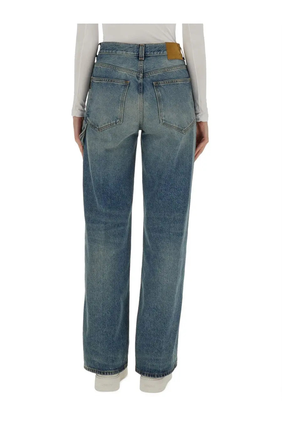 Haikure women’s high-waisted faded blue denim jeans with straight-leg cut and brown leather brand patch at waistband