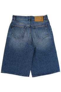 Back side of haikure women’s new becky denim shorts in blue with faded wash and classic back pockets