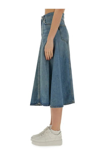 Haikure women’s serenity midi skirt in medium blue high-waisted denim with subtle fading and frayed hem