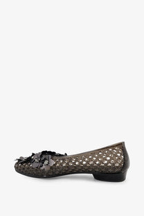 Heavenly jelly women’s nova pvc ballerinas black featuring dark brown woven flat shoe with black floral embellishment on toe