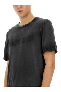 Helmut Lang men’s garment dyed black short-sleeved t-shirt with faded textured fabric and contrast stitching