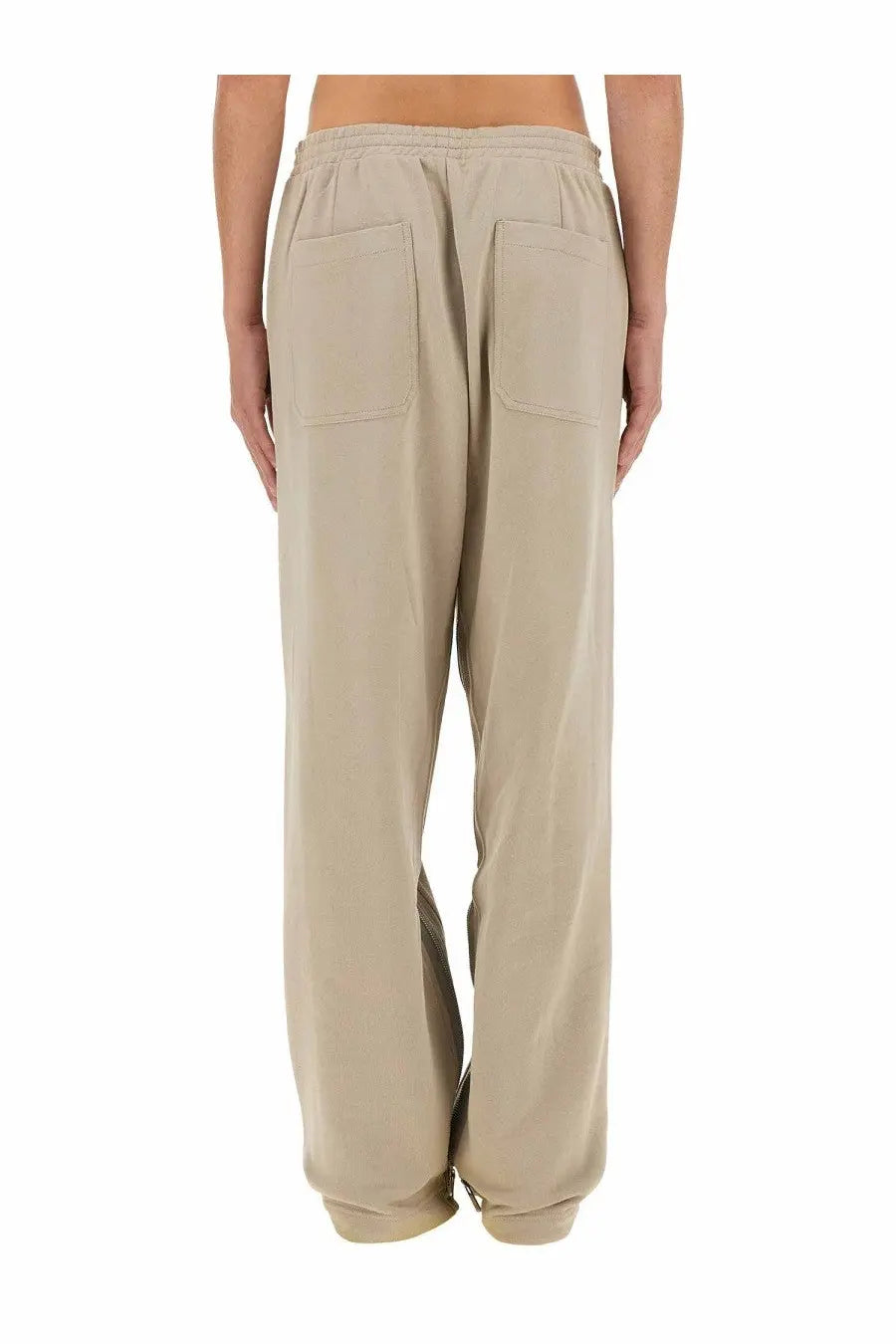 Back view of helmut lang men’s jogging pants in grey with a relaxed fit wide-leg design and two back pockets