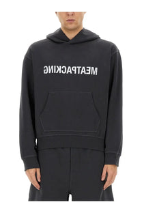 Helmut Lang men’s black hooded sweatshirt with white meatpacking lettering and front pocket in cotton blend material