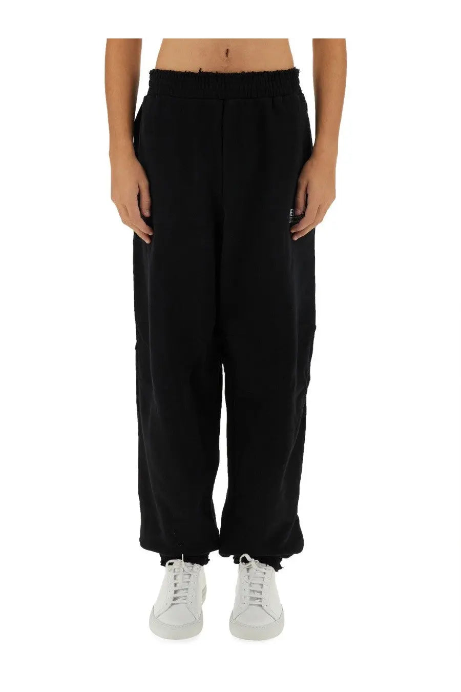 Helmut Lang men’s New York pants in black loose-fitting sweatpants with ribbed elastic waistband and frayed hem
