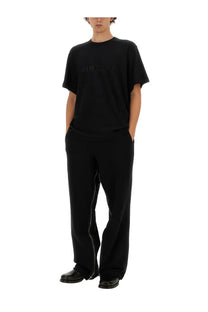 Helmut Lang men’s black t shirt with subtle embossed balenciaga logo across the chest in cotton material